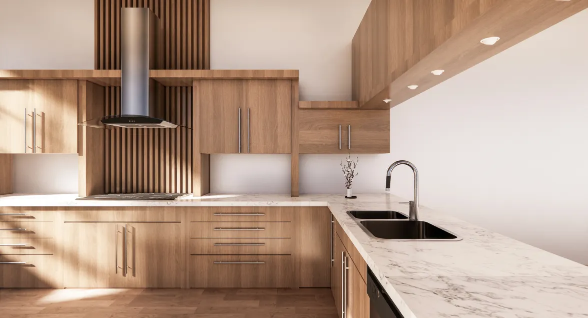 Modern kitchen with light wood cabinets, white countertops, and stainless steel sink.