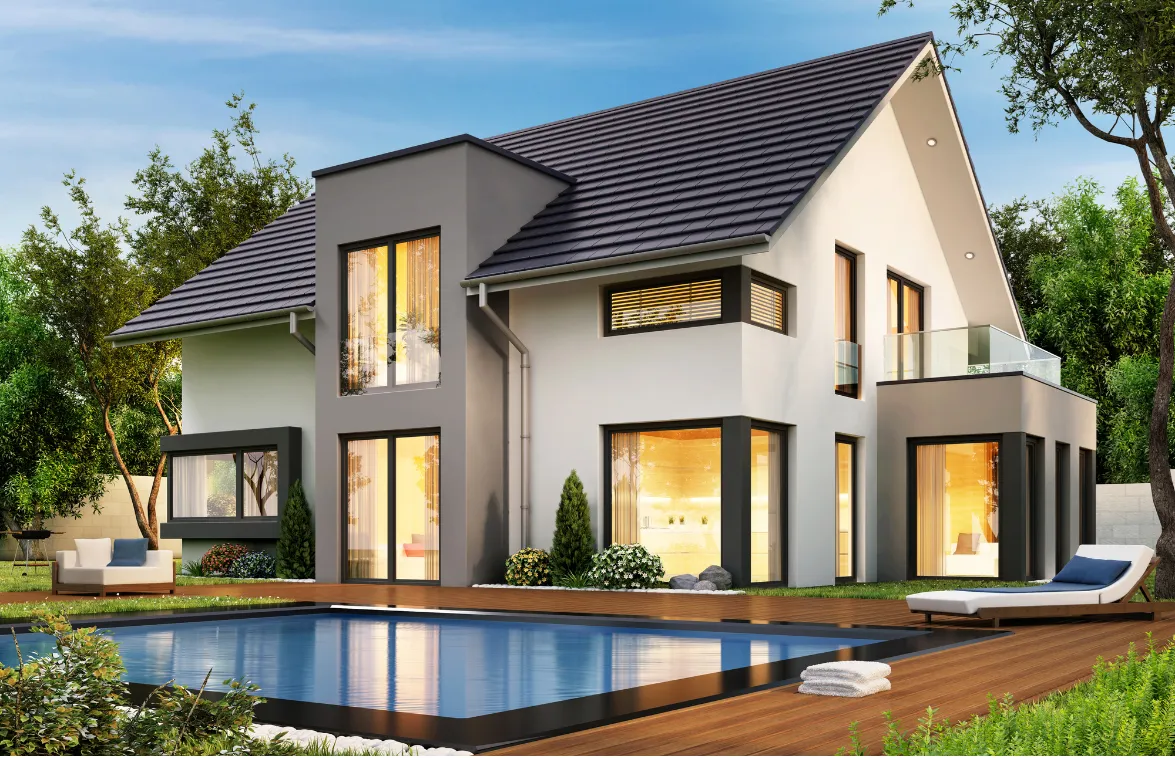 Modern two-story house with a pool in the backyard, set in a lush green landscape.